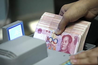 Китай установил курс юаня на самом низком уровне за последние 4 года  - ảnh 1